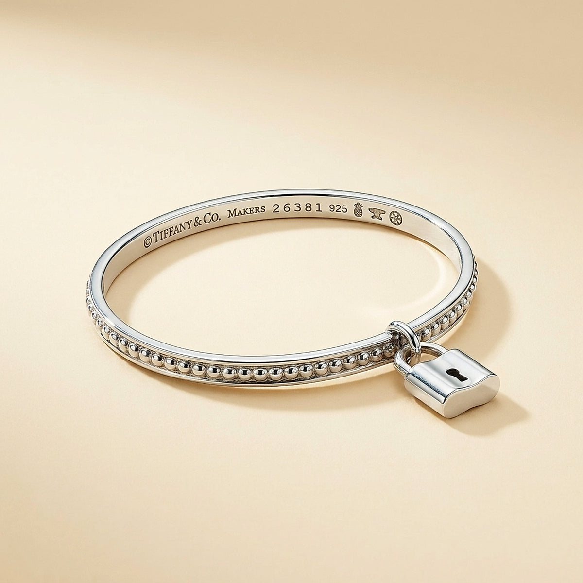 Tiffany & Co. Sterling Silver Beaded Bangle with Padlock Charm