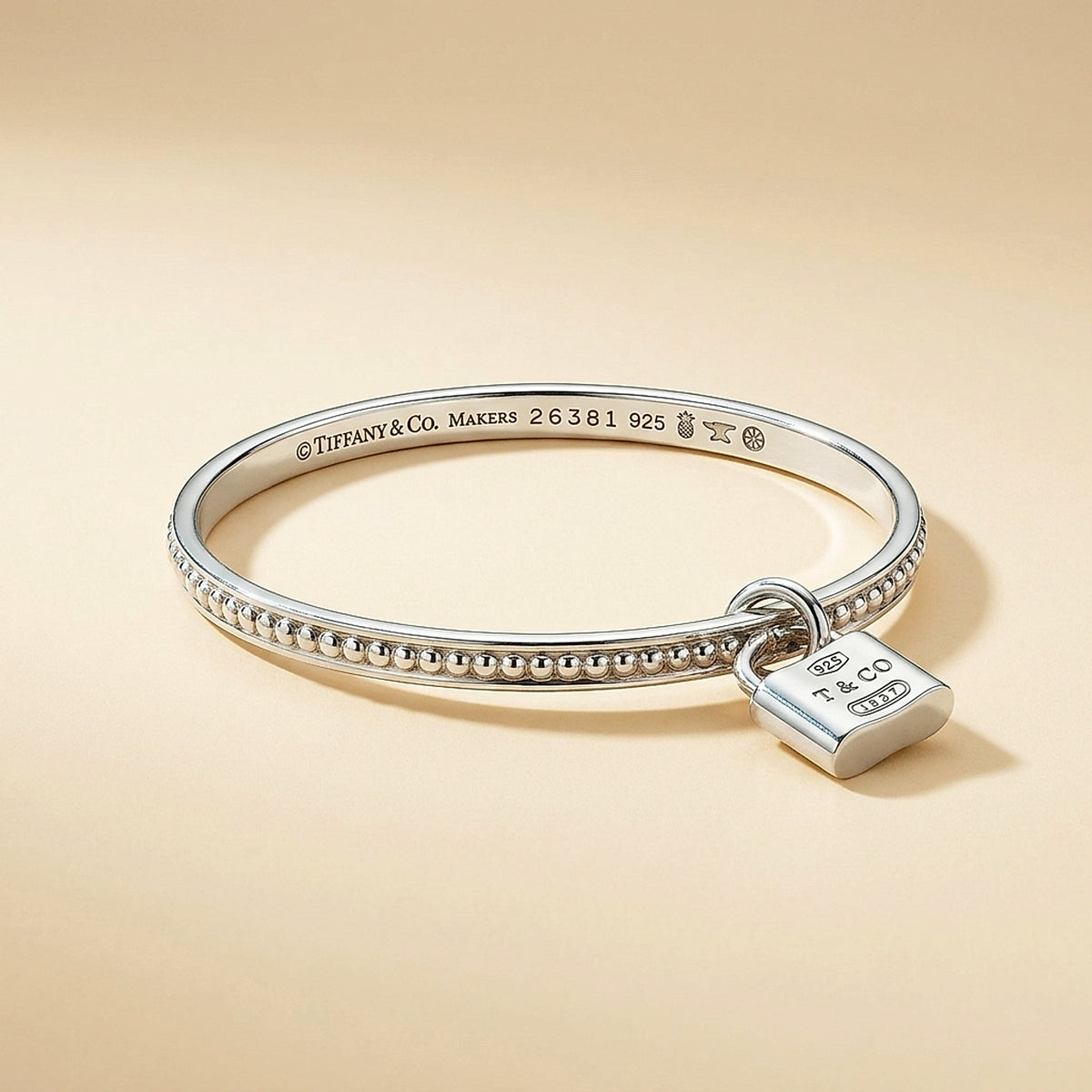 Tiffany & Co. Sterling Silver Beaded Bangle with Padlock Charm