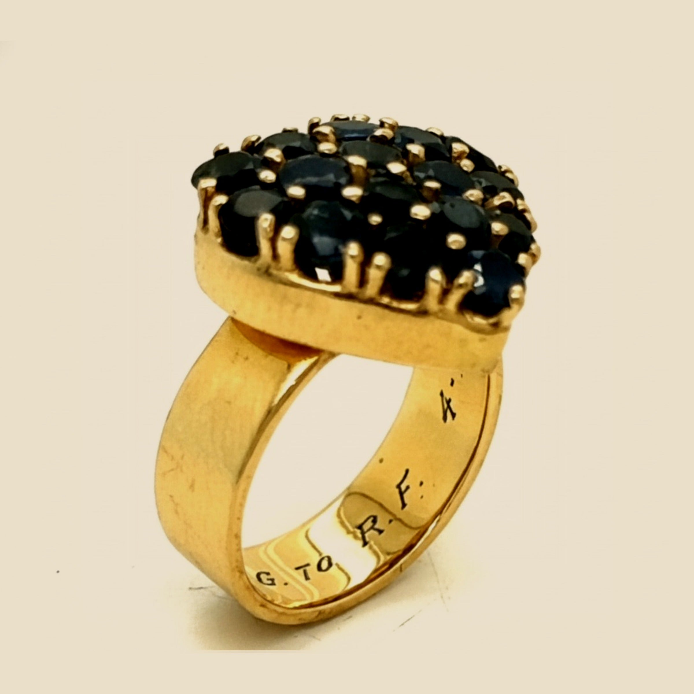 Yellow Gold Heart filled with round Sapphires