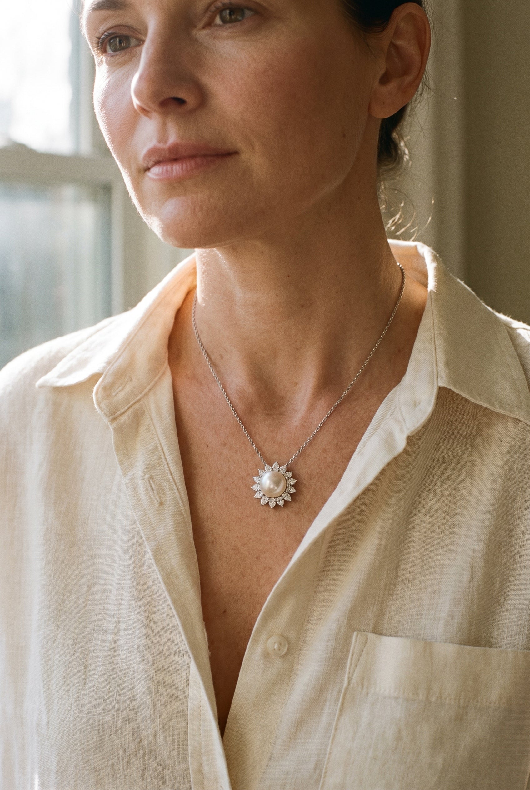 Tiffany & Co. Platinum Diamond and Pearl Pendant — shown worn