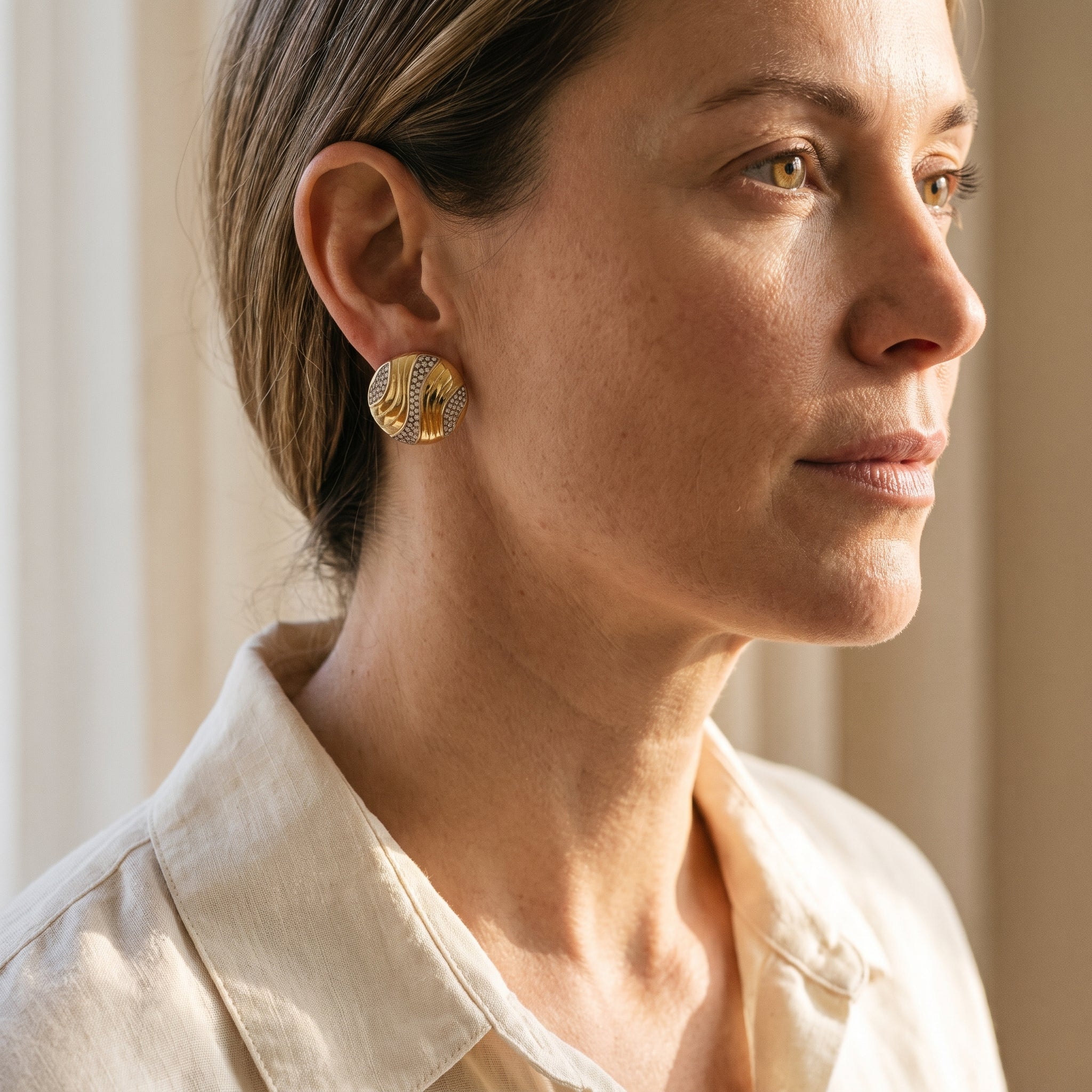 Tiffany & Co. Gold and Diamond Ear Clips — shown worn