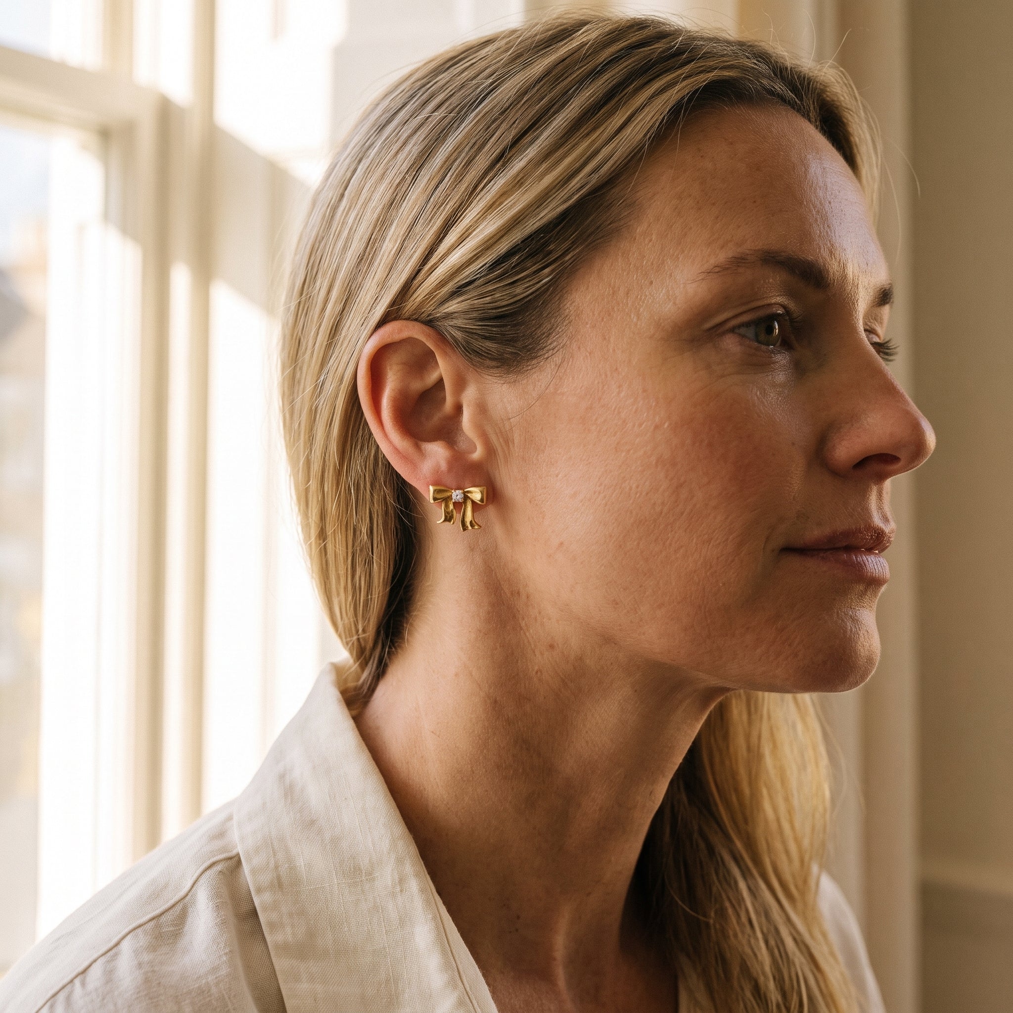 Tiffany & Co. 18k Yellow Gold Diamond Bow Earrings — shown worn