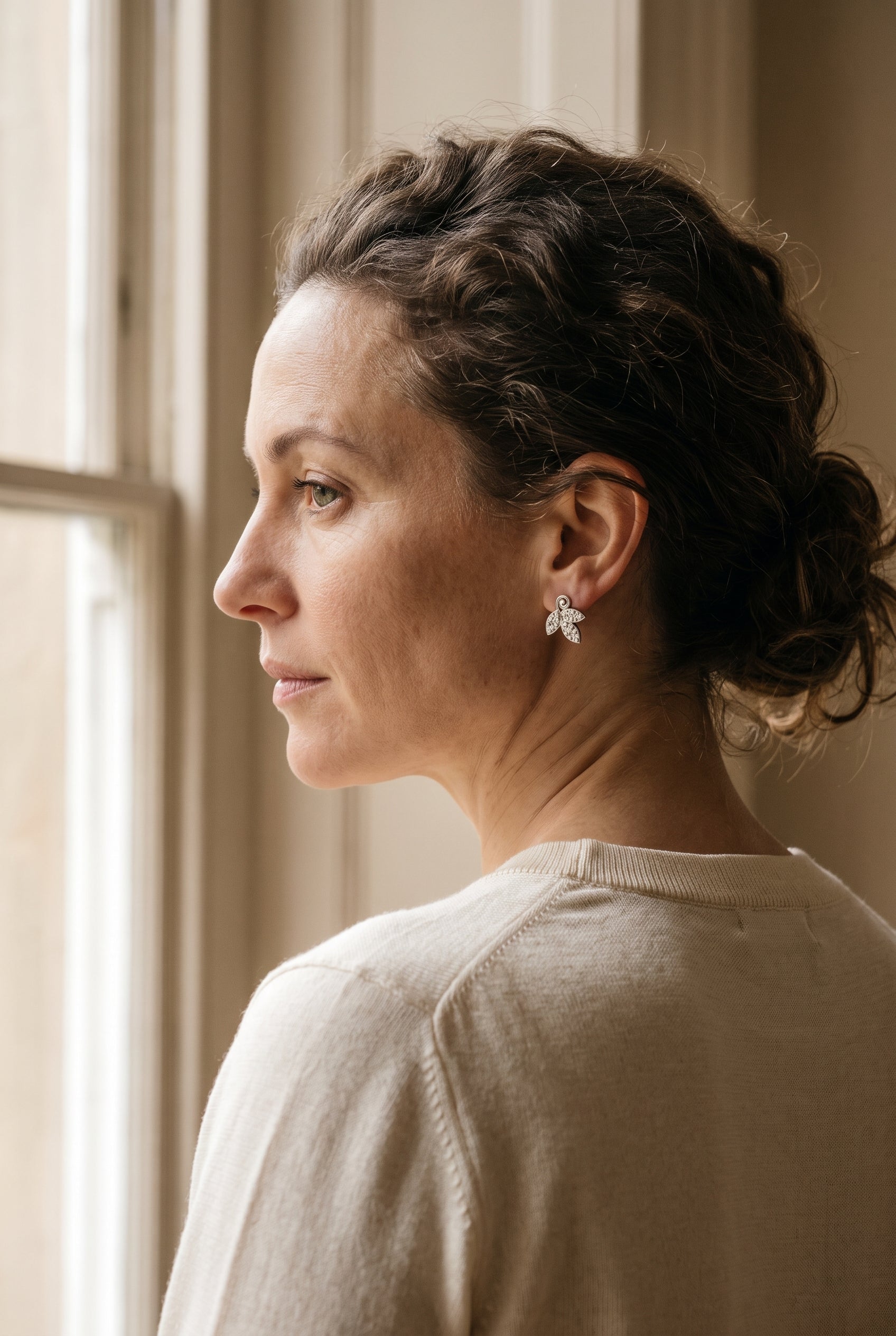 Tiffany & Co. 18k White Gold Diamond Leaf Earrings — shown worn, second view