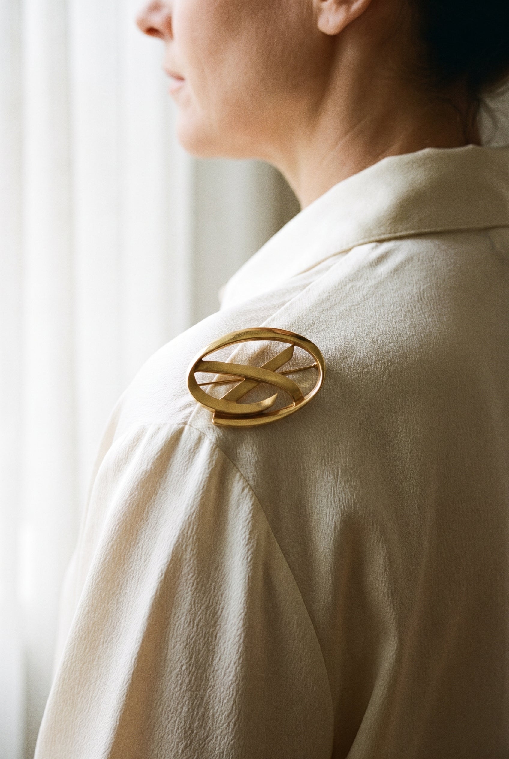 Tiffany & Co. Paloma Picasso Oval Open "X" Pin/Brooch — shown worn, second view