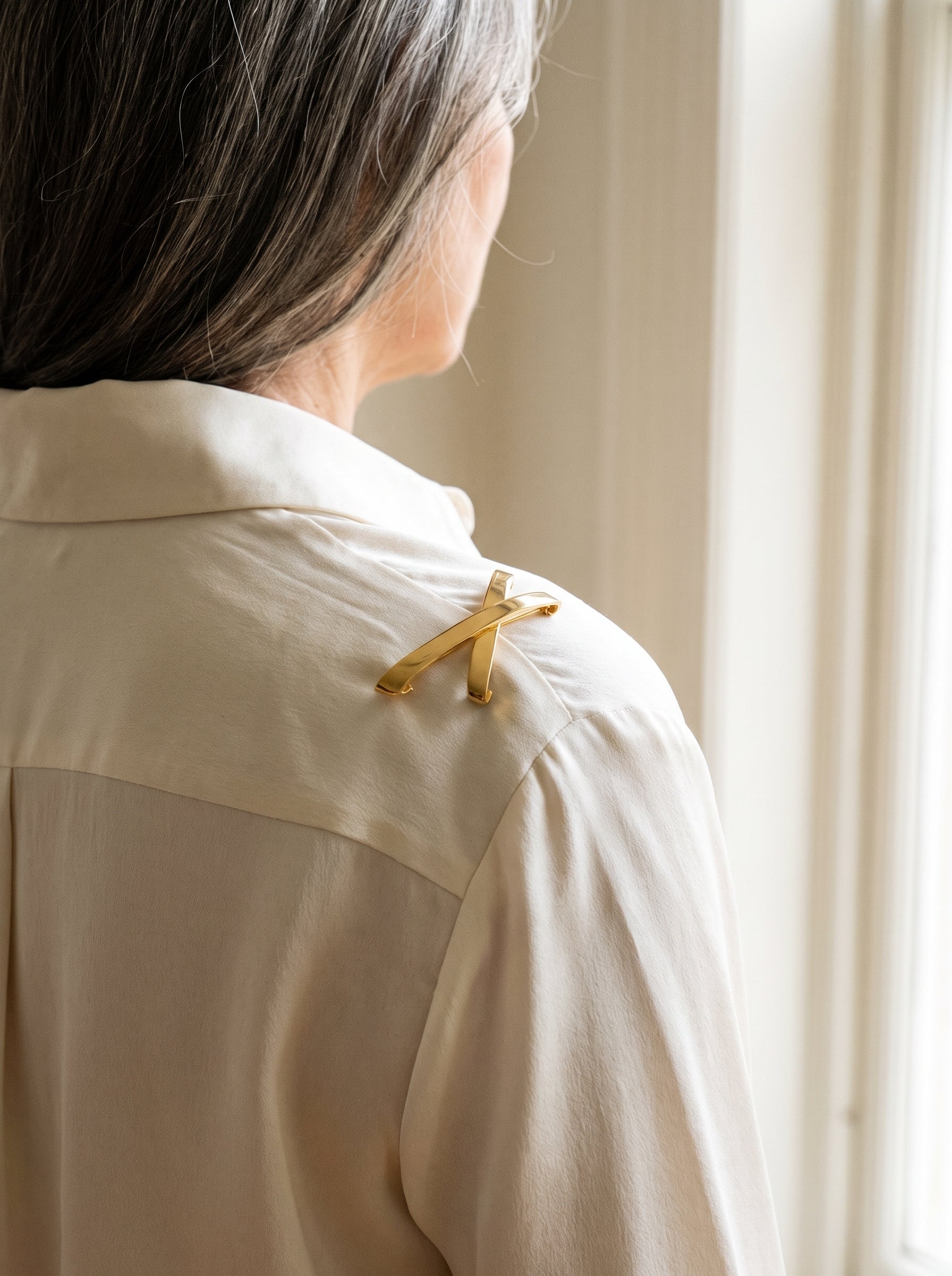 Tiffany & Co. Yellow Gold Large "X" Pin/Pendant — shown worn, second view