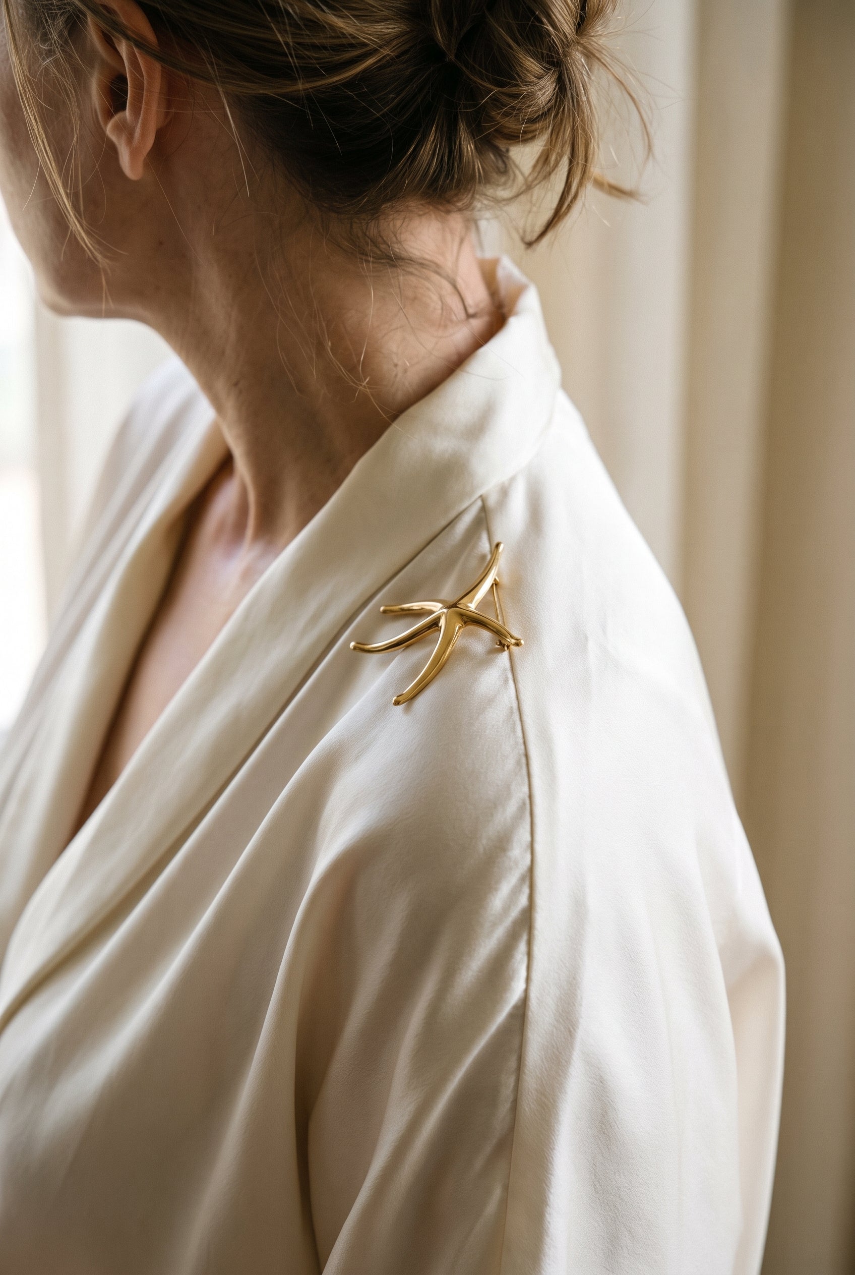 Tiffany Elsa Peretti Starfish Pin — shown worn, second view