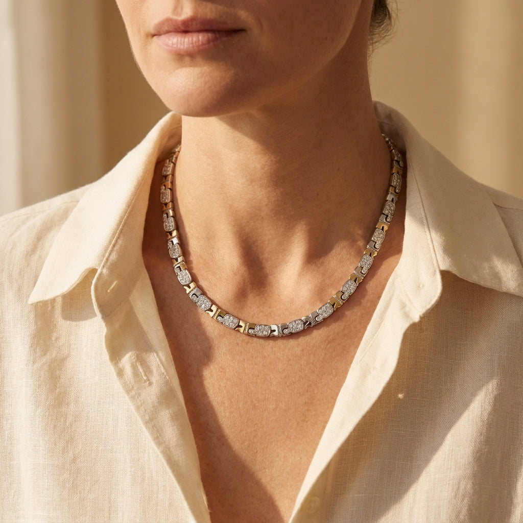 Andre Courreges diamond turtle links line necklace worn at an open linen collar, editorial lifestyle photo