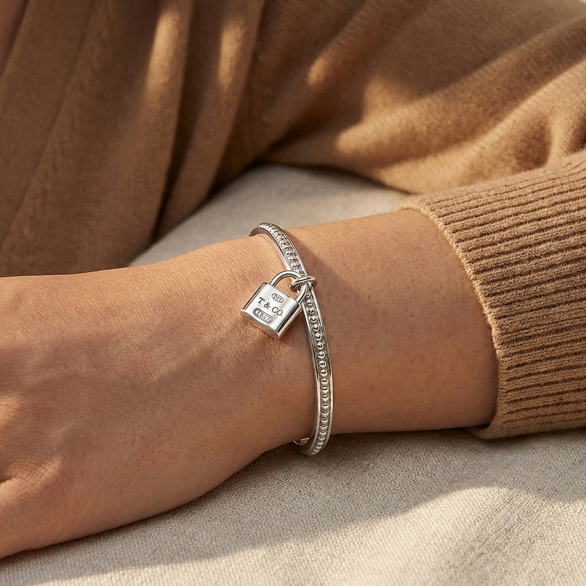 Tiffany & Co. Sterling Silver Beaded Bangle with Padlock Charm